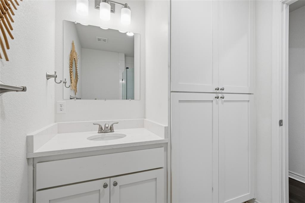 3227 Proctor Avenue Waco, TX 76708 - Photo 20 of 23 a bathroom with a sink and a mirror