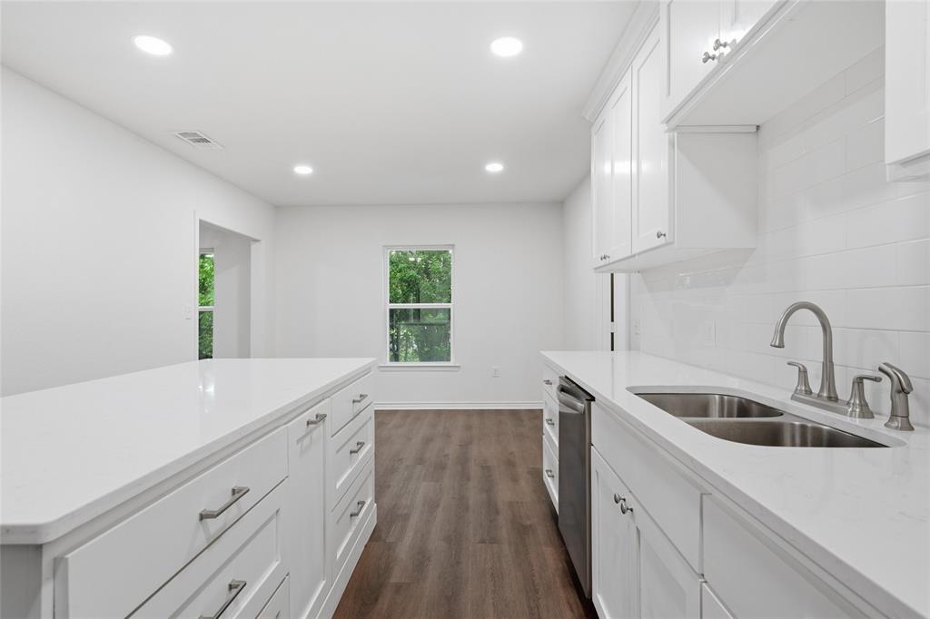 3227 Proctor Avenue Waco, TX 76708 - Photo 9 of 23 a kitchen with a sink a counter top space and appliances