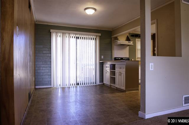 600 Hoge Road Reno, NV 89506 - Photo 3 of 13 a view of a kitchen with a stove wooden floor and a window