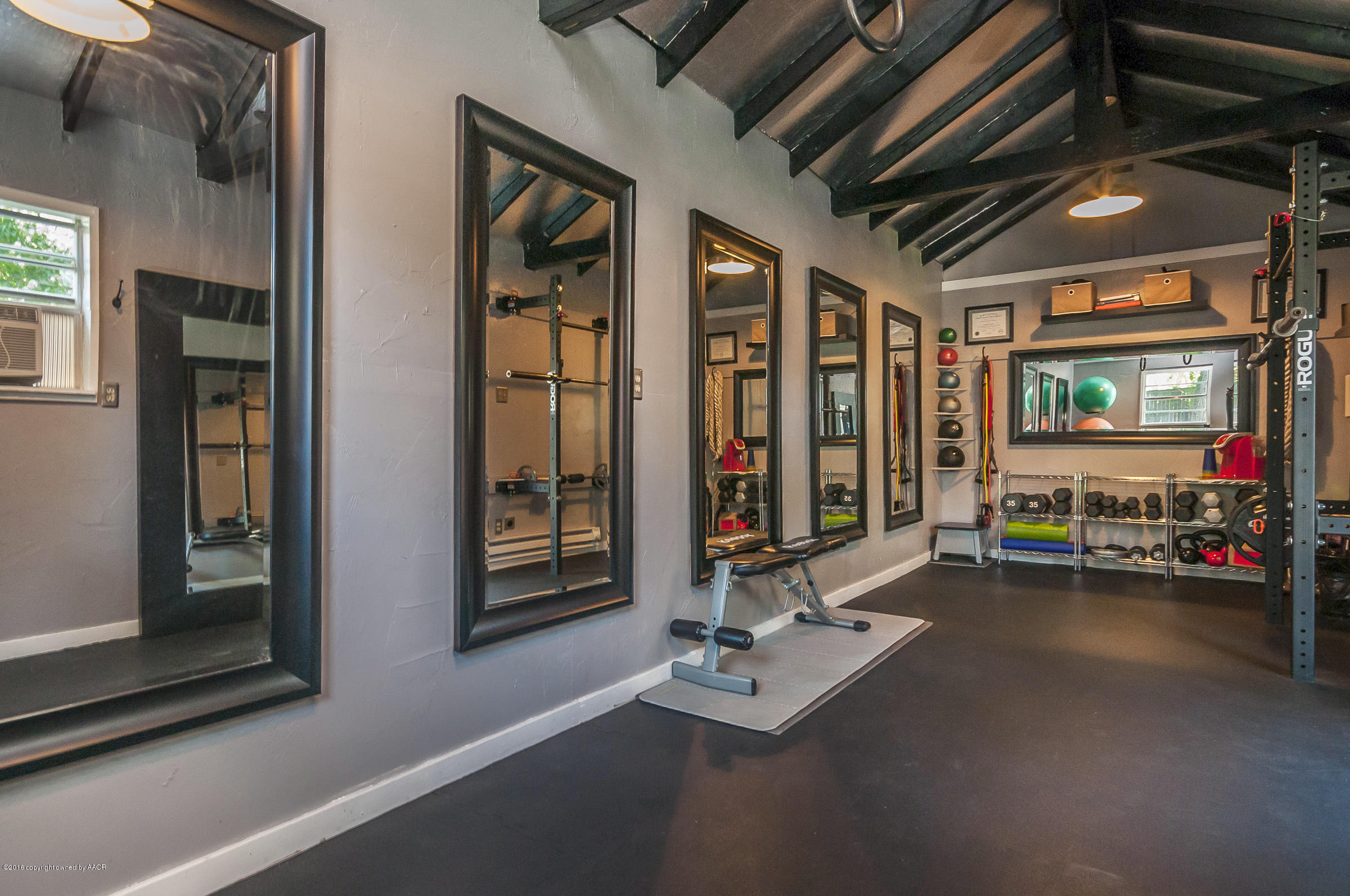 2208 South Lipscomb Street Amarillo, TX 79109 - Photo 14 of 18 a view of a room with gym equipment