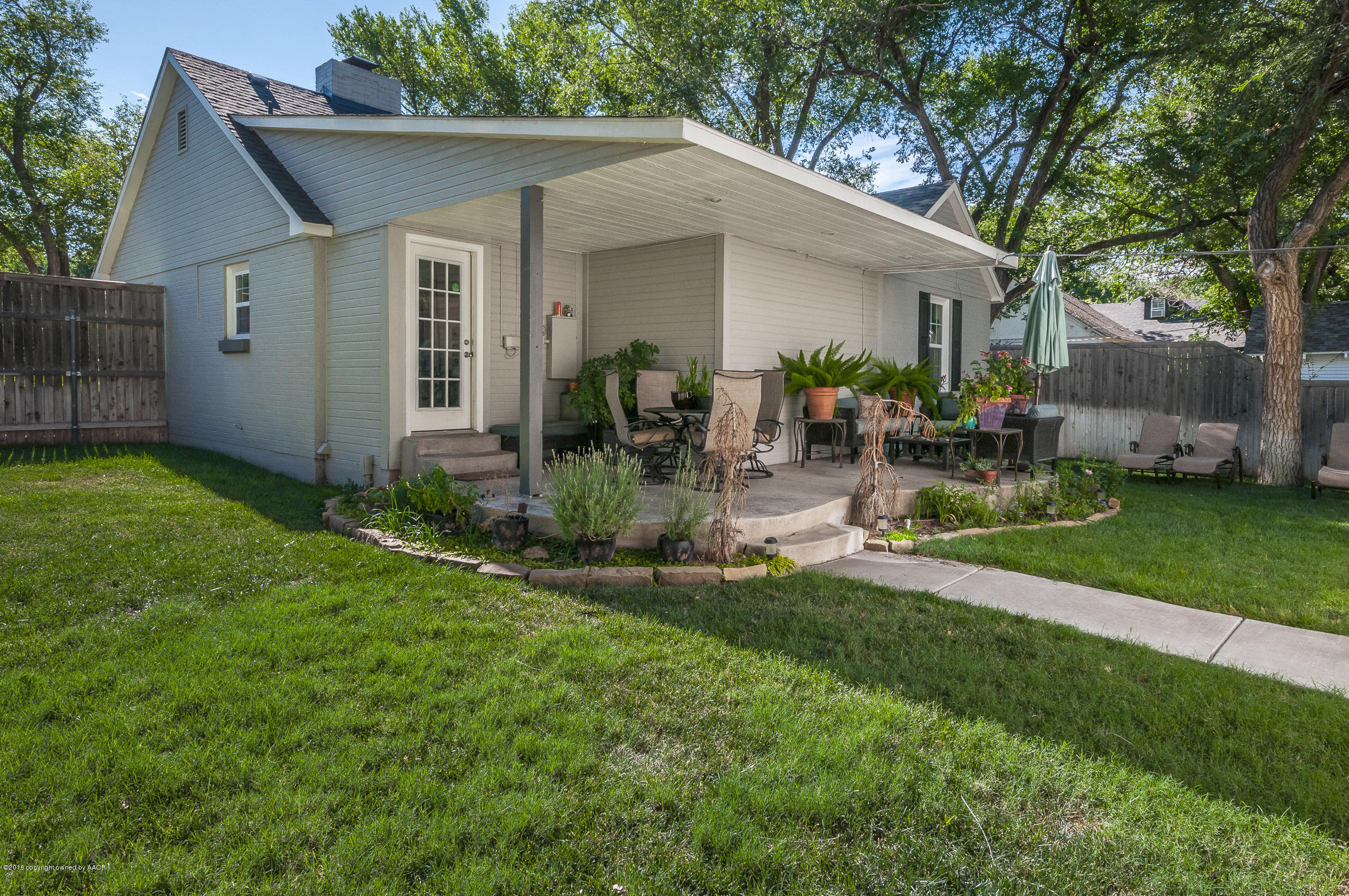 2208 South Lipscomb Street Amarillo, TX 79109 - Photo 17 of 18 a front view of house with yard and outdoor seating