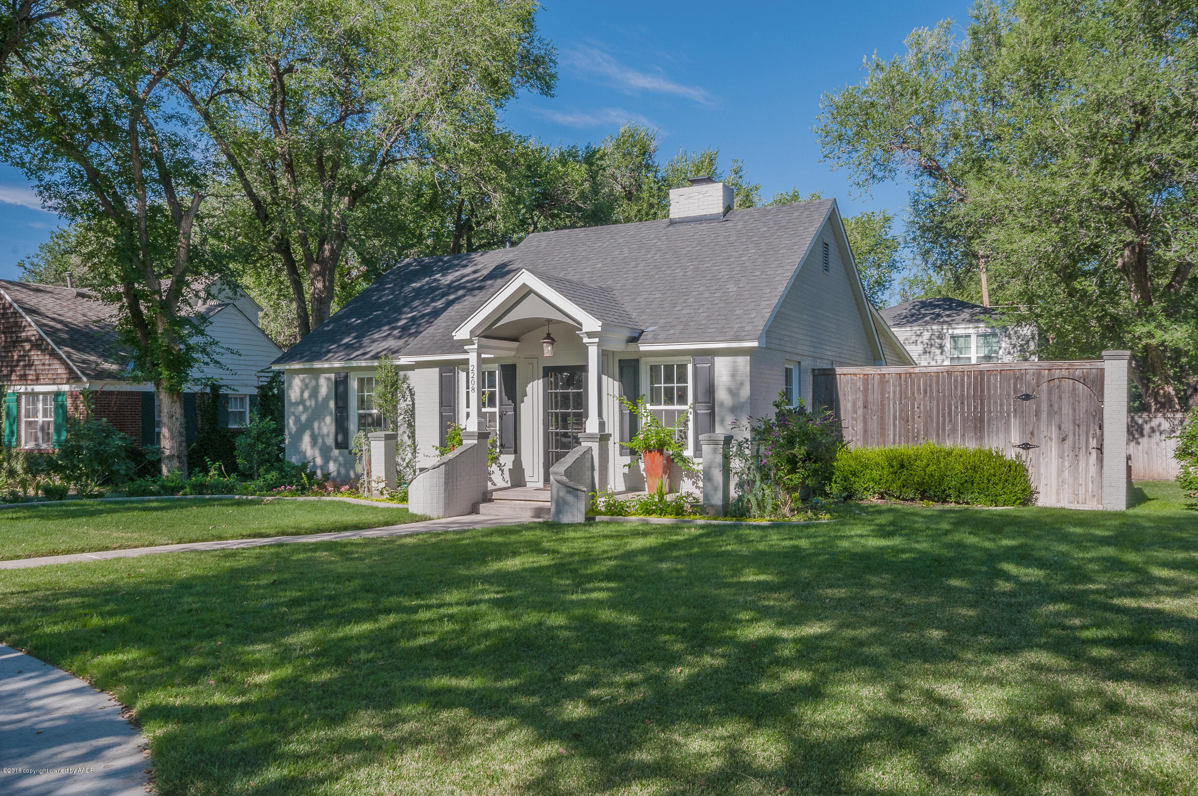 2208 South Lipscomb Street Amarillo, TX 79109 - Photo 2 of 18 a front view of a house with a yard