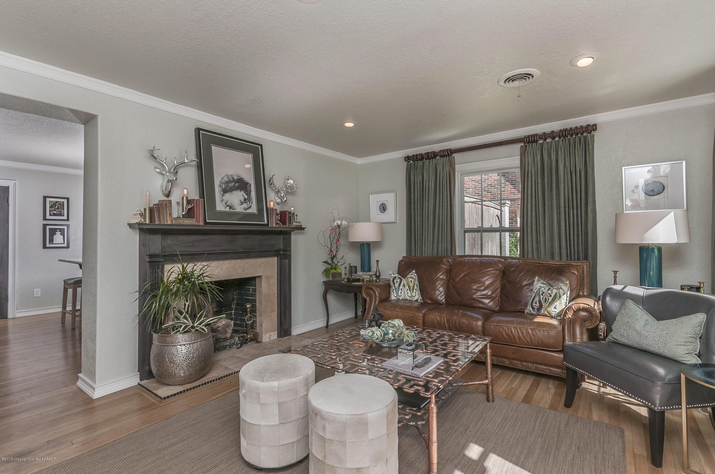 2208 South Lipscomb Street Amarillo, TX 79109 - Photo 4 of 18 a living room with furniture and a fireplace