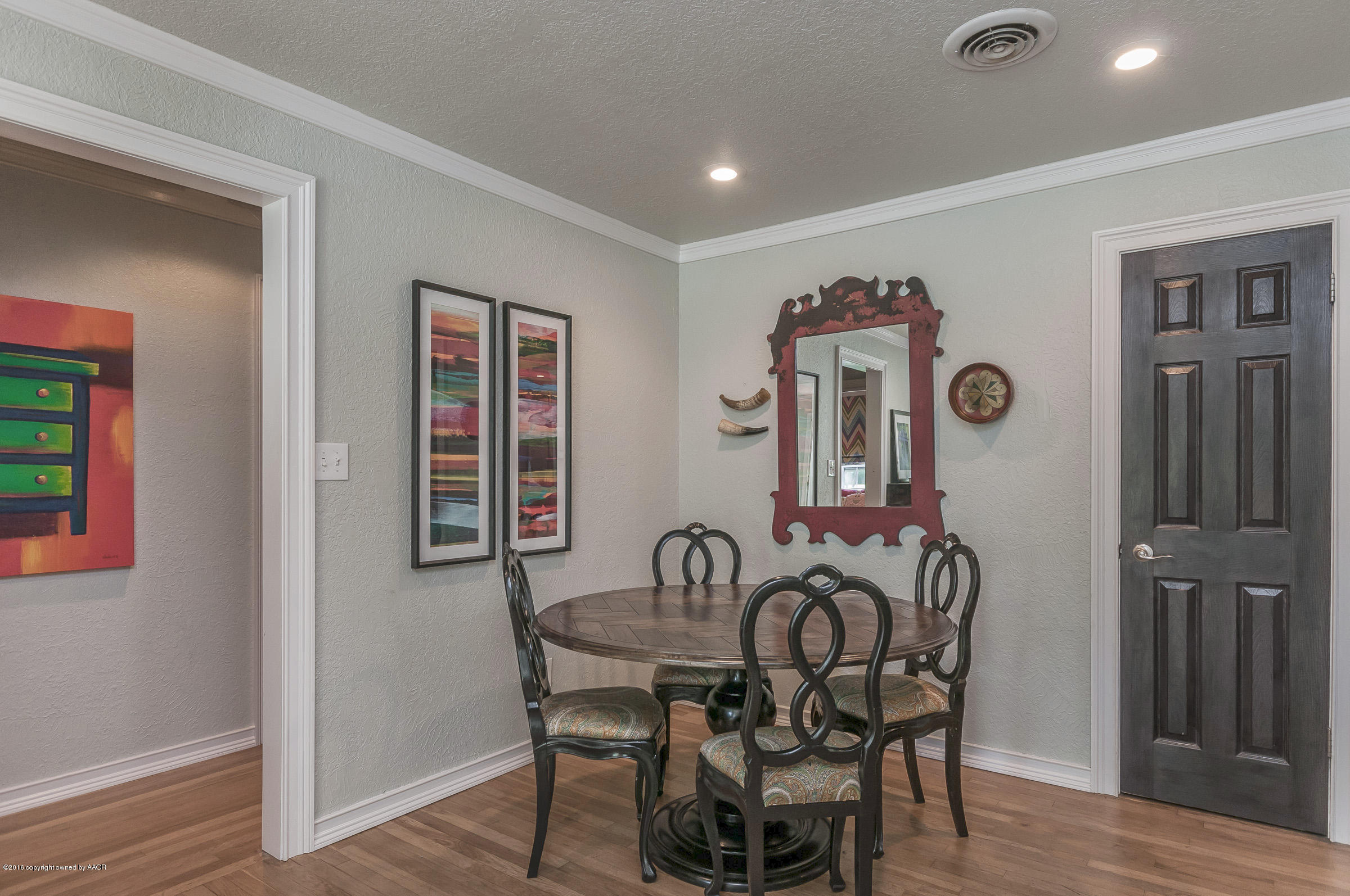 2208 South Lipscomb Street Amarillo, TX 79109 - Photo 8 of 18 a view of a dining room with furniture and wooden floor