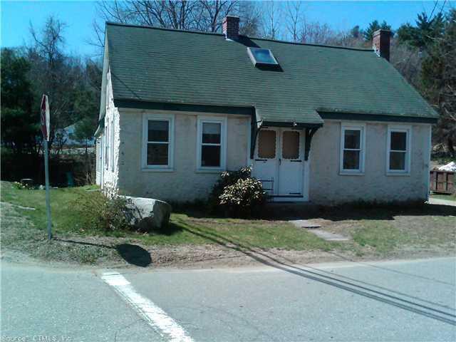 1374 Riverside Drive Thompson, CT 06255 - Photo 1 of 1 a front view of a house with a yard