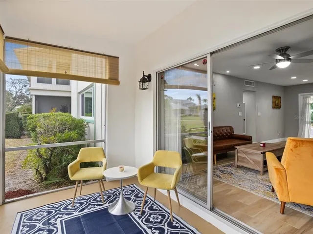 a view of a livingroom with furniture and a table