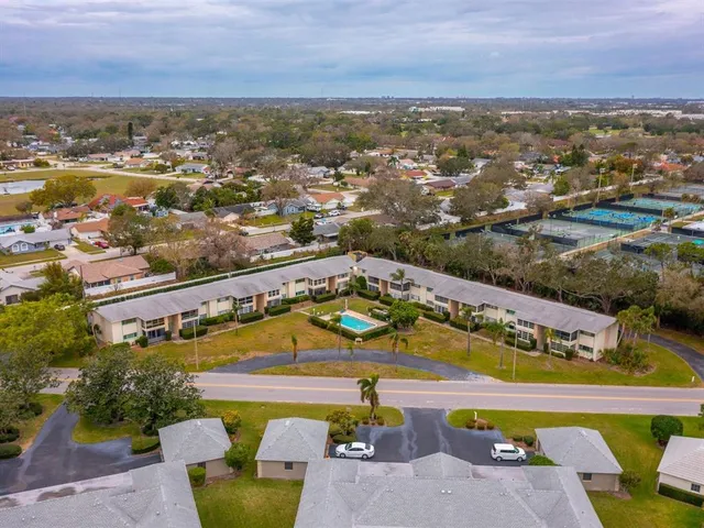 an aerial view of residential building and ocean