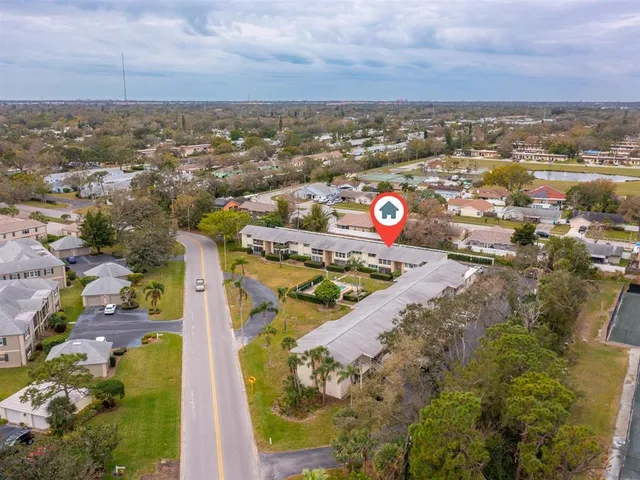 an aerial view of a house with outdoor space