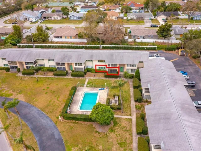 an aerial view of a house with a swimming pool