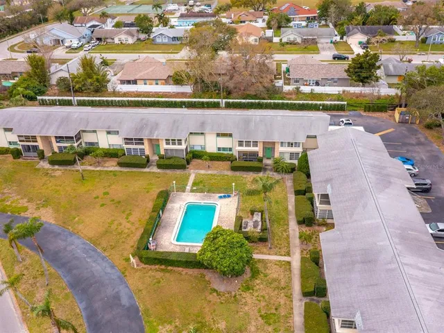 an aerial view of a house with a swimming pool