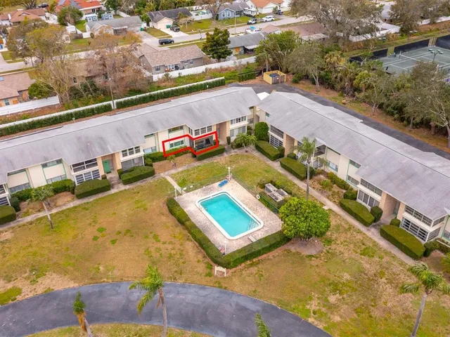 an aerial view of a house with a swimming pool