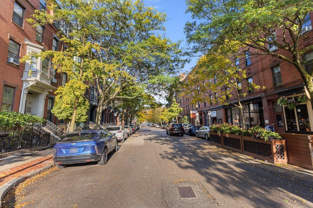 242 Shawmut Avenue, Unit 1B Boston, MA 02118 - Photo 14 of 16 a car parked on the side of a street