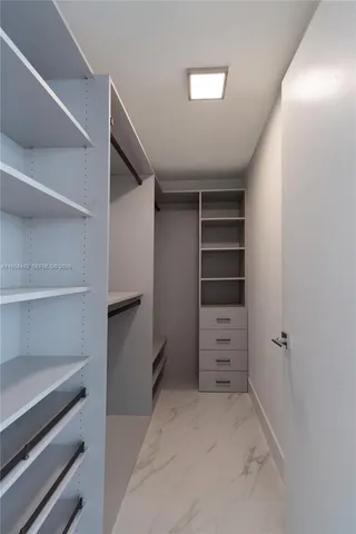 a view of an empty walk in closet
