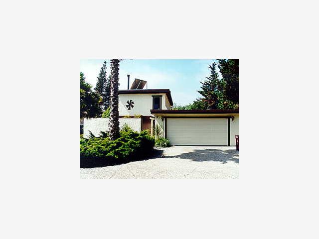 783 Graham Hill Road Scotts Valley, CA 95060 - Photo 1 of 1 a picture of a person on a street