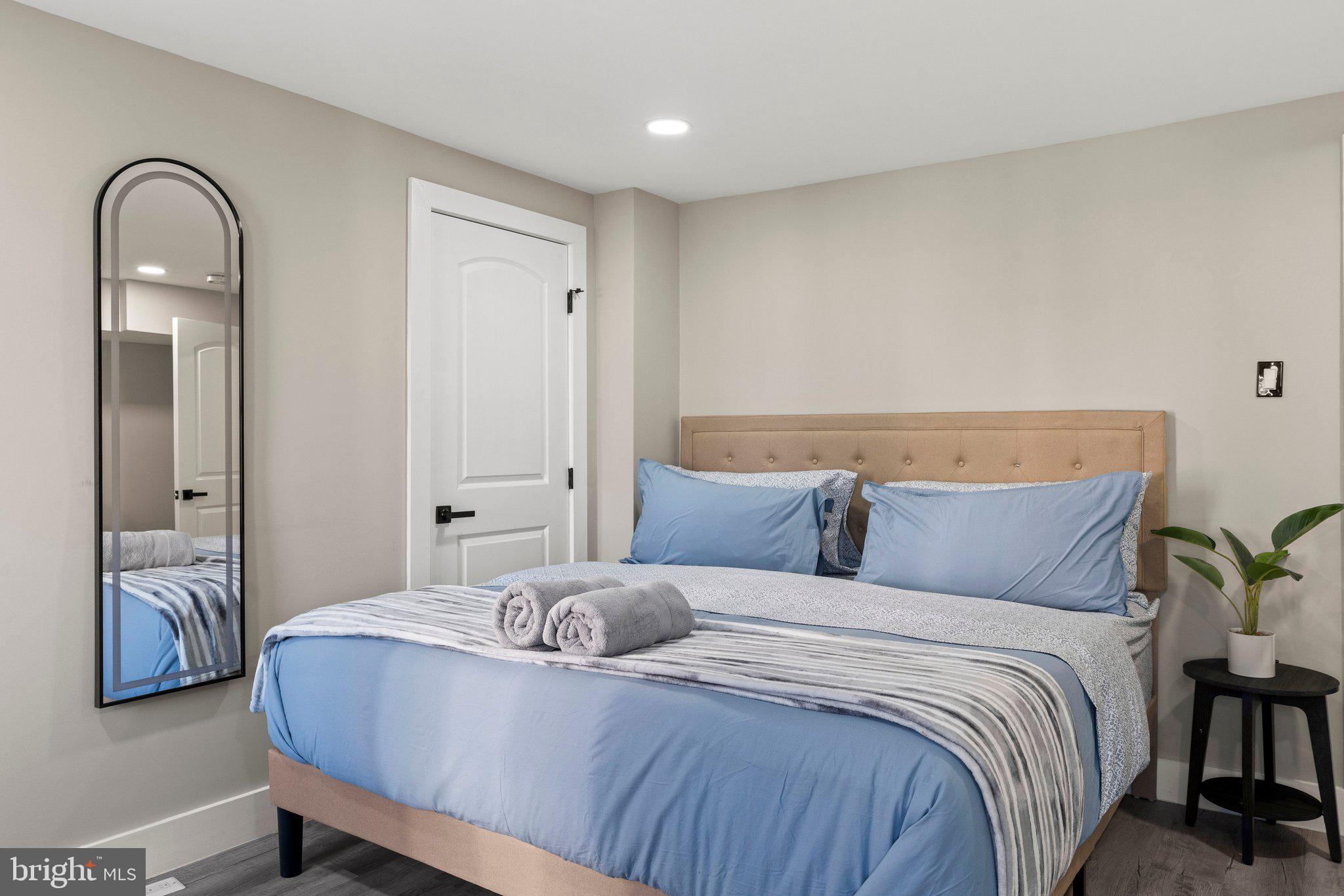 124 Master Street Philadelphia, PA 19122 - Photo 23 of 39 a bedroom with a bed and a painting on the wall