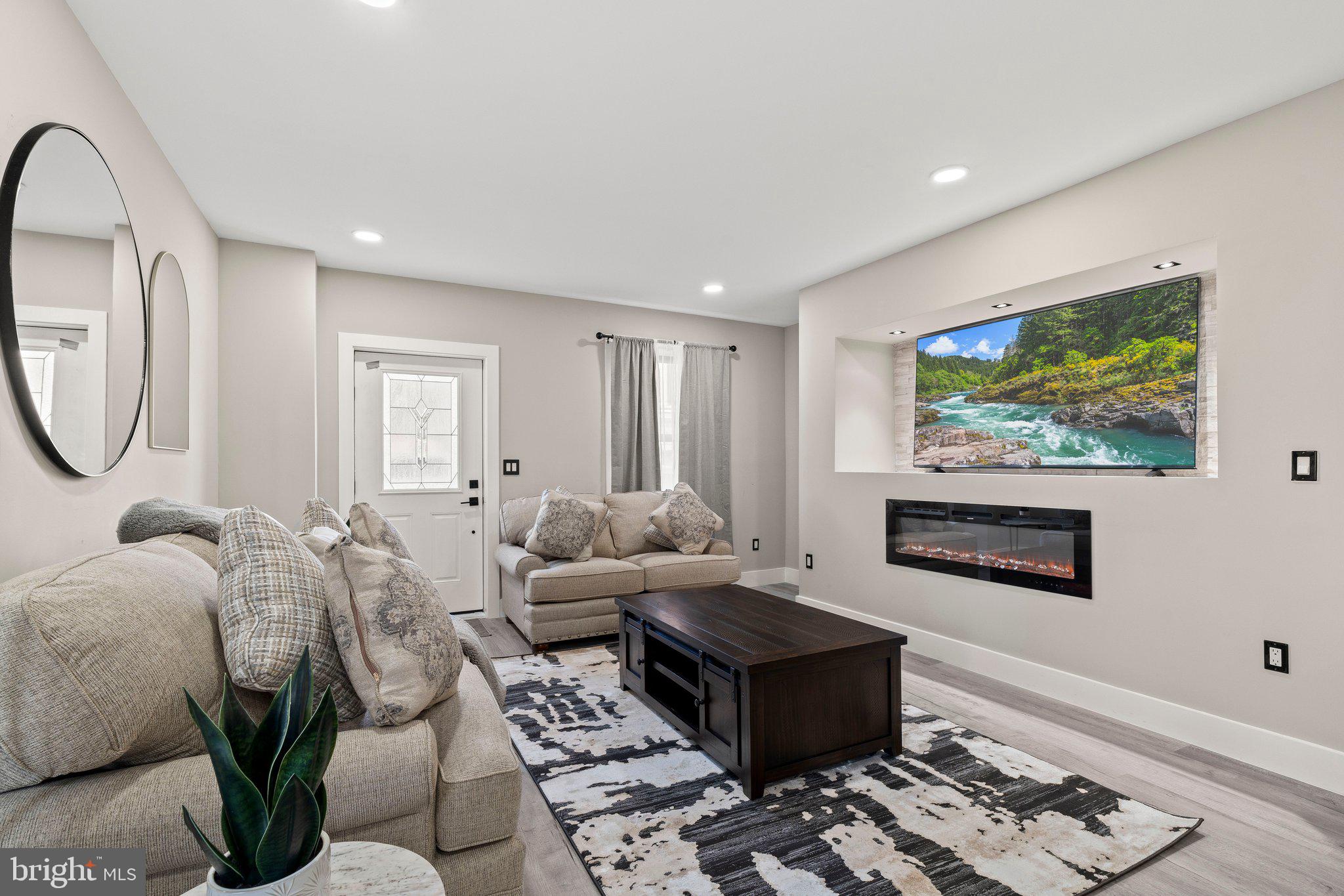 124 Master Street Philadelphia, PA 19122 - Photo 3 of 39 a living room with furniture a rug and a painting