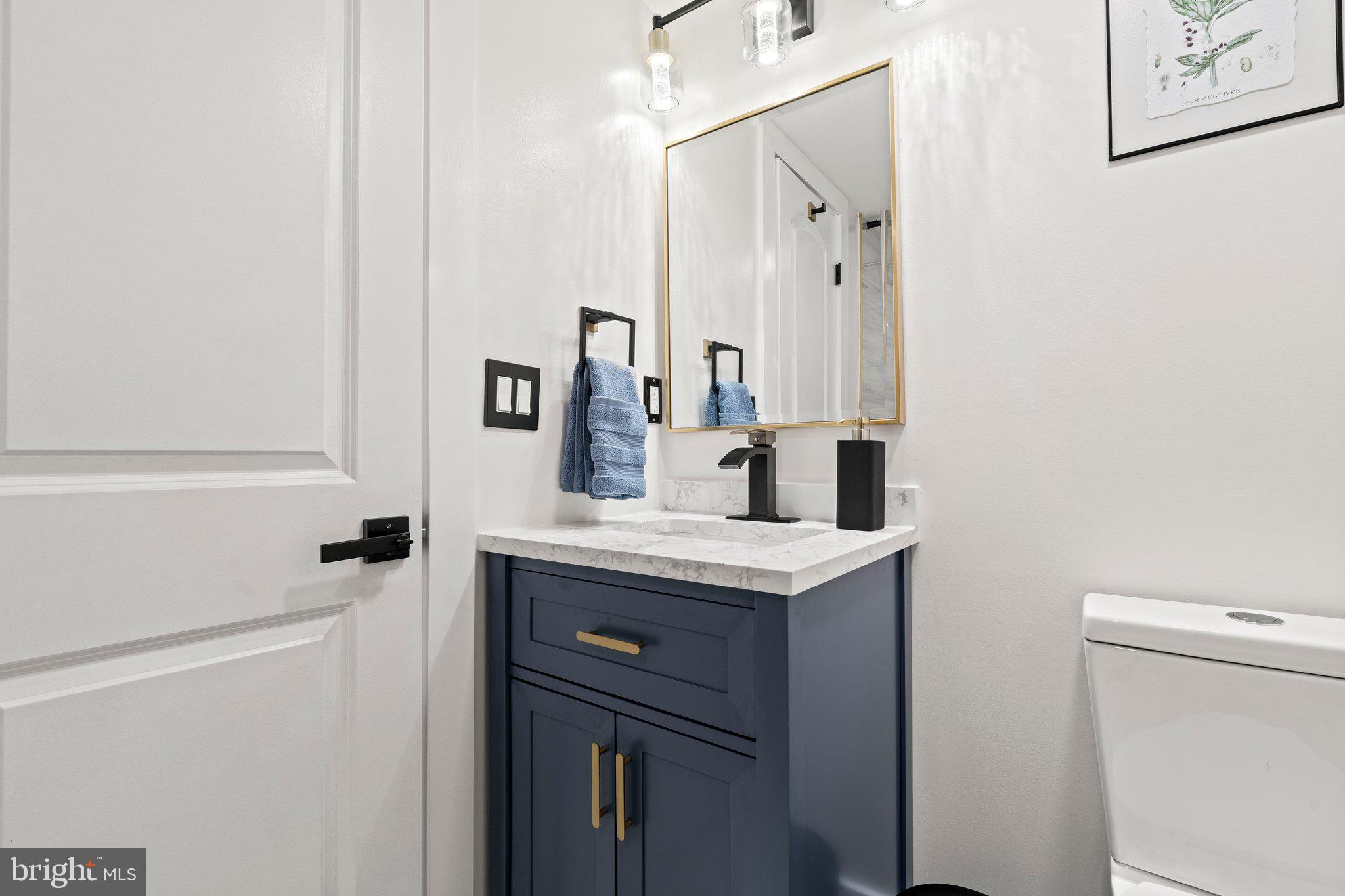 124 Master Street Philadelphia, PA 19122 - Photo 33 of 39 a bathroom with a sink a toilet and mirror