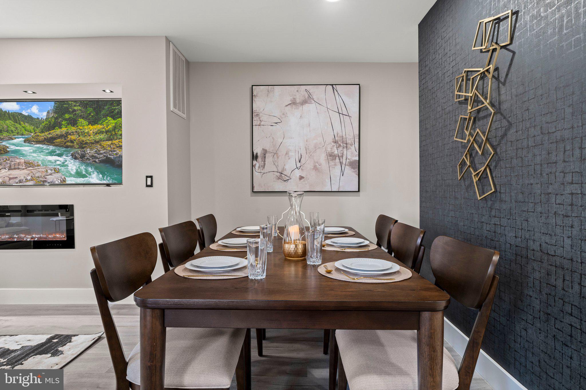 124 Master Street Philadelphia, PA 19122 - Photo 6 of 39 a view of a dining room with furniture a rug and wooden floor
