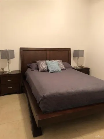 a bedroom with a bed and dresser