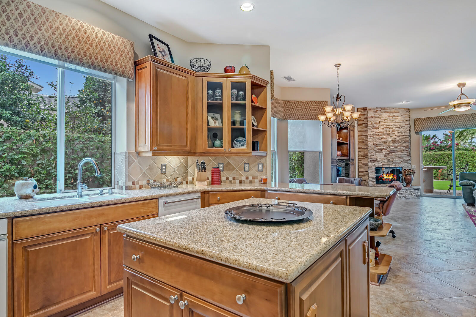 3 Lyon Road Rancho Mirage, CA 92270 - Photo 11 of 38 a kitchen with a sink a stove and a window