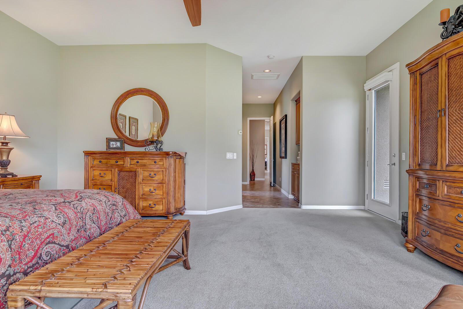 3 Lyon Road Rancho Mirage, CA 92270 - Photo 15 of 38 a bedroom with a bed and a potted plant