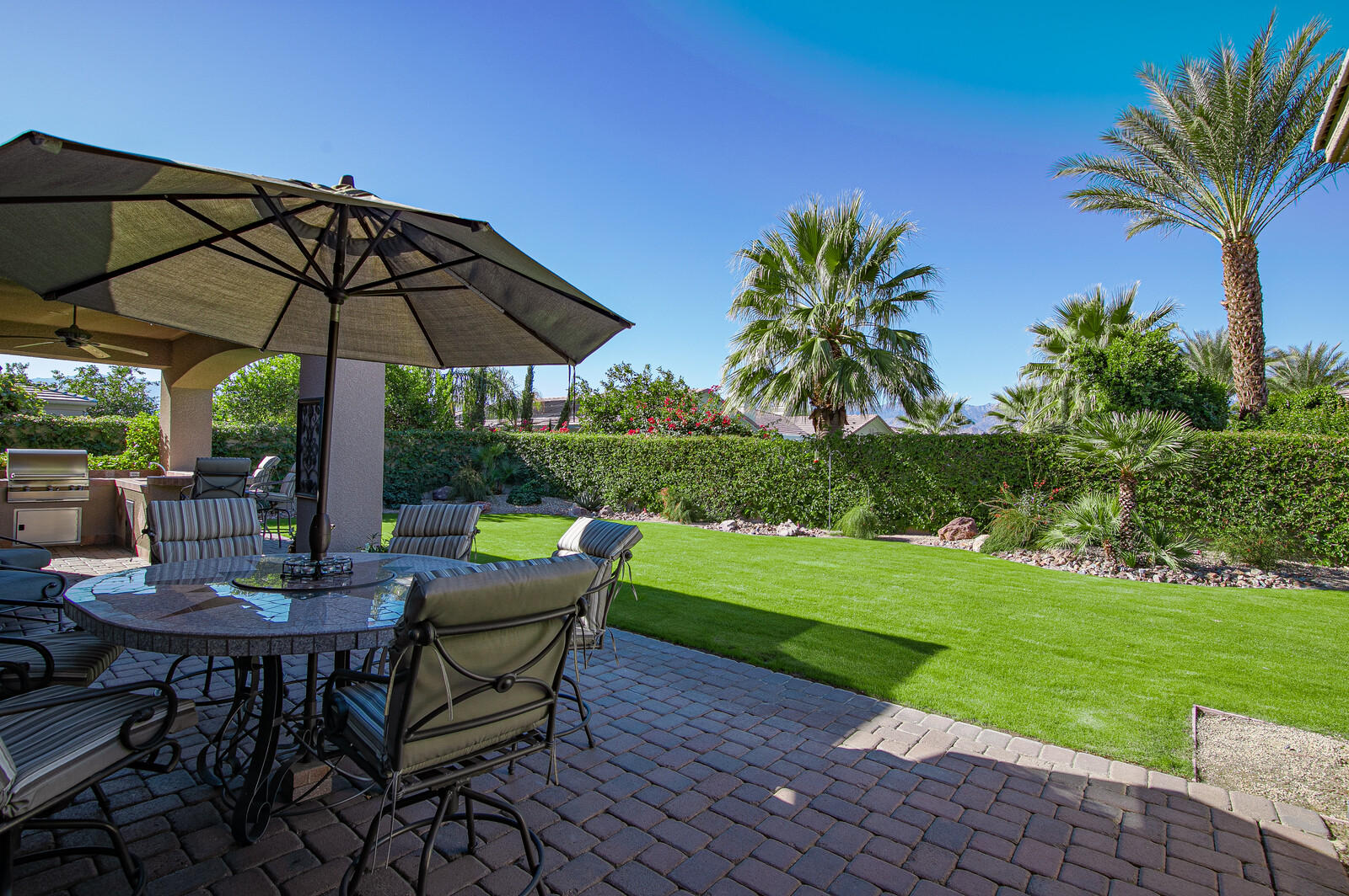 3 Lyon Road Rancho Mirage, CA 92270 - Photo 16 of 38 a view of a chair and table in the garden