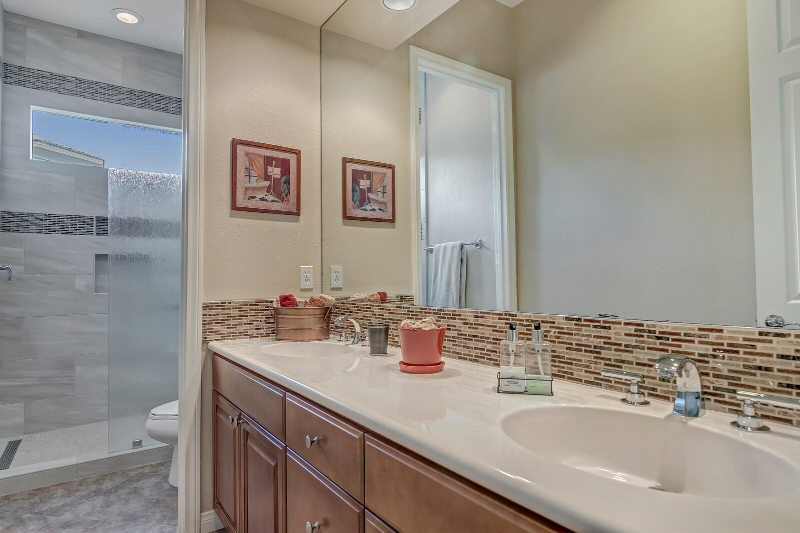 3 Lyon Road Rancho Mirage, CA 92270 - Photo 21 of 38 a bathroom with a sink and a mirror