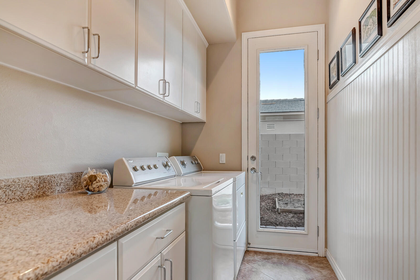 3 Lyon Road Rancho Mirage, CA 92270 - Photo 25 of 38 a utility room with cabinets washer and dryer
