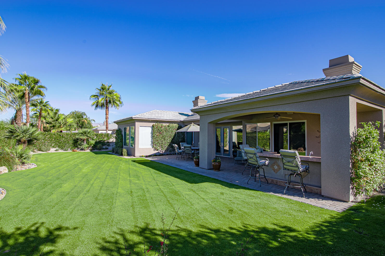 3 Lyon Road Rancho Mirage, CA 92270 - Photo 26 of 38 a view of an house with backyard porch and sitting area
