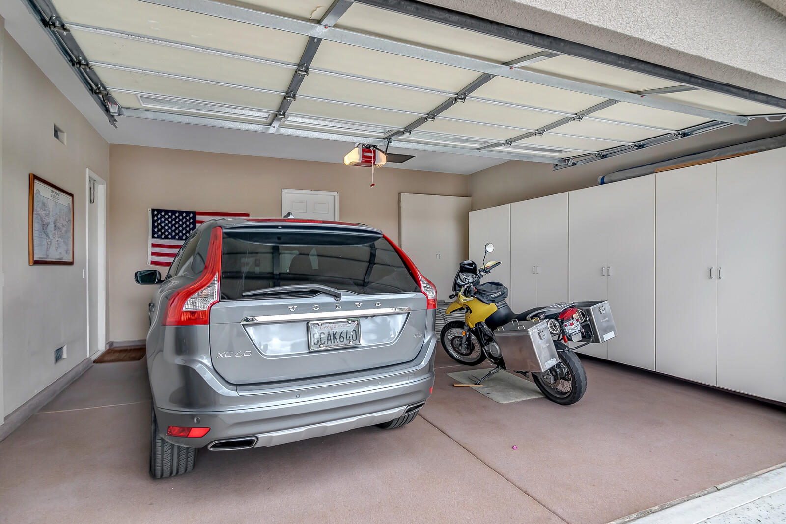 3 Lyon Road Rancho Mirage, CA 92270 - Photo 29 of 38 a car and bike parked in a garage