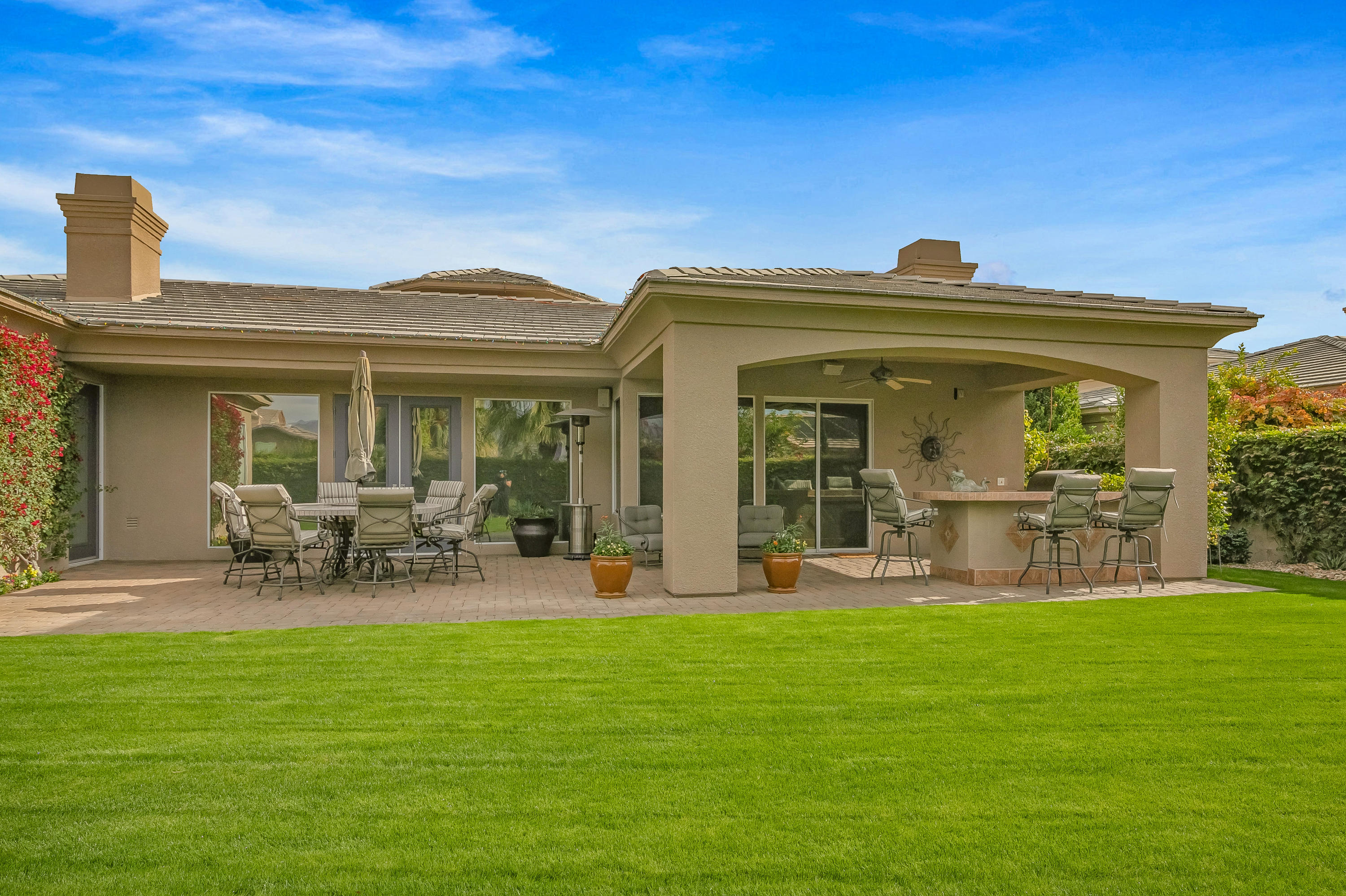 3 Lyon Road Rancho Mirage, CA 92270 - Photo 36 of 38 a front view of house with yard and outdoor seating
