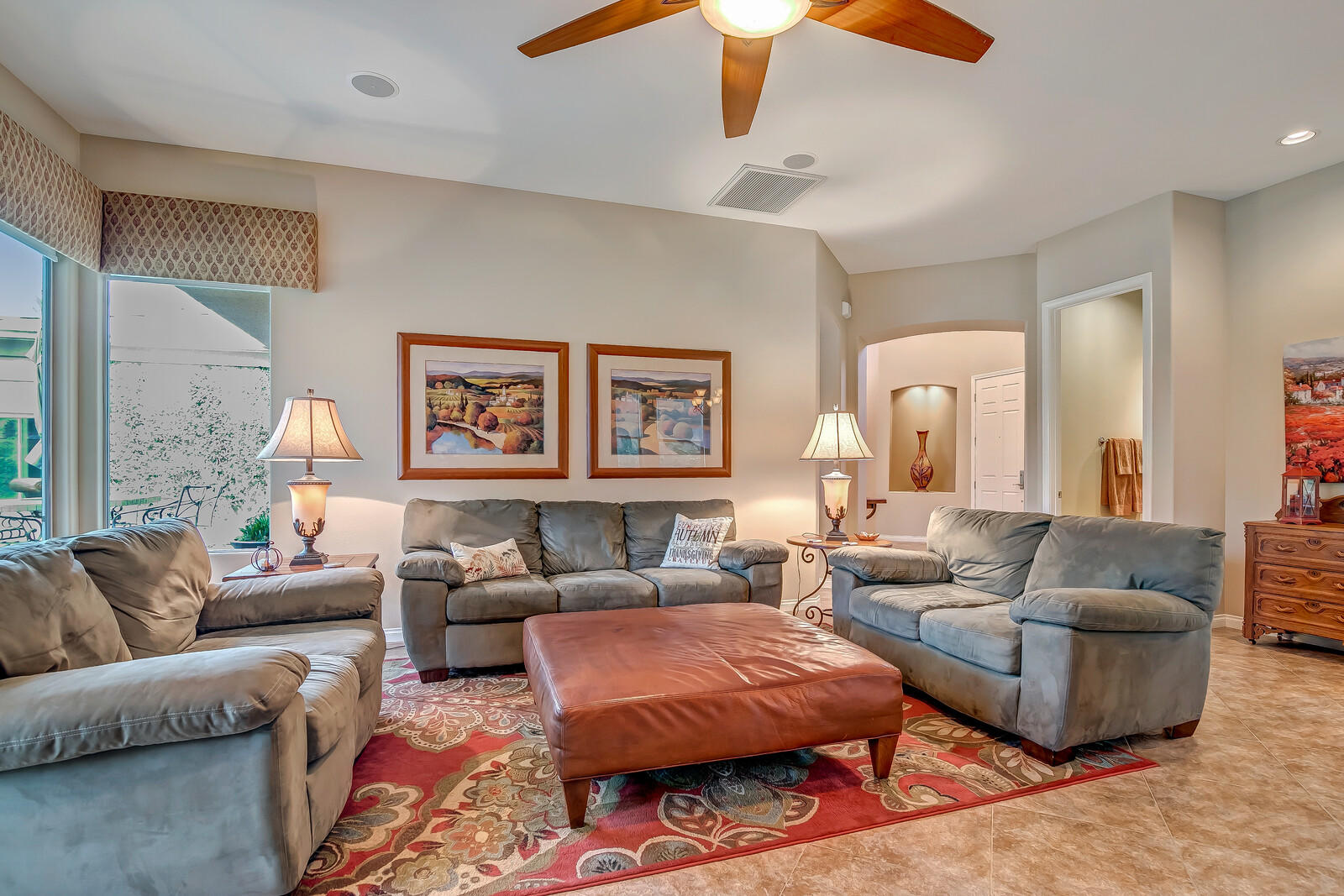 3 Lyon Road Rancho Mirage, CA 92270 - Photo 5 of 38 a living room with furniture a rug and a chandelier