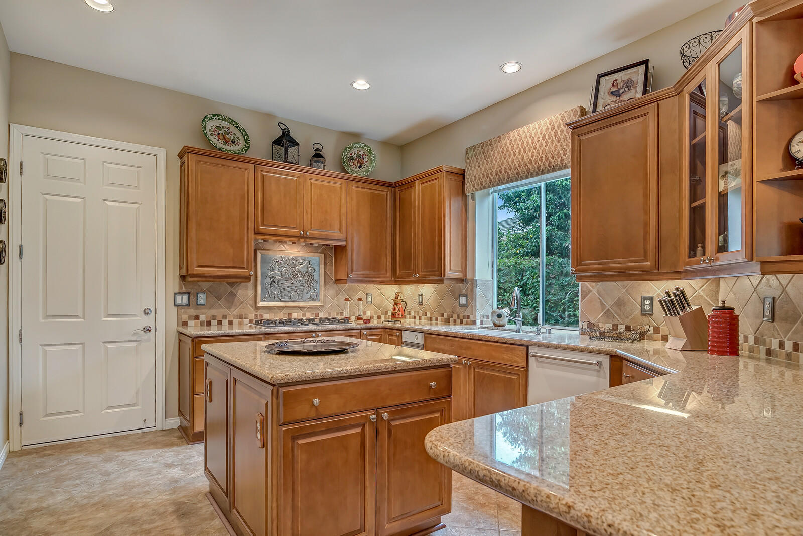 3 Lyon Road Rancho Mirage, CA 92270 - Photo 10 of 38 a kitchen with a sink stove and cabinets