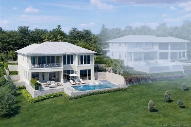 a patio with a table and chairs under an umbrella