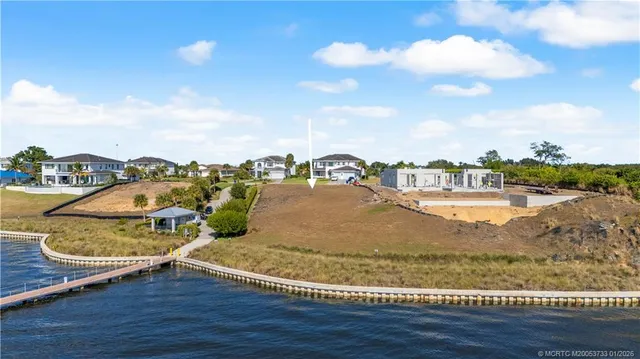 a view of a swimming pool with a lounge chairs