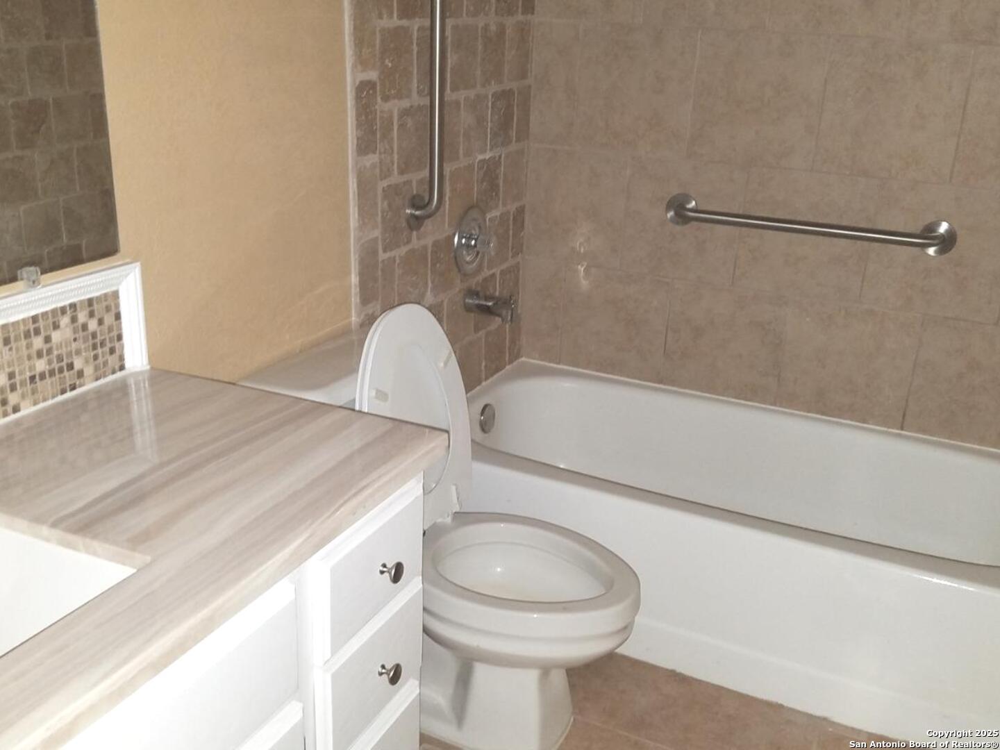 11839 Parliament Drive, Unit 1921 San Antonio, TX 78216 - Photo 12 of 19 a bathroom with a sink a toilet and shower