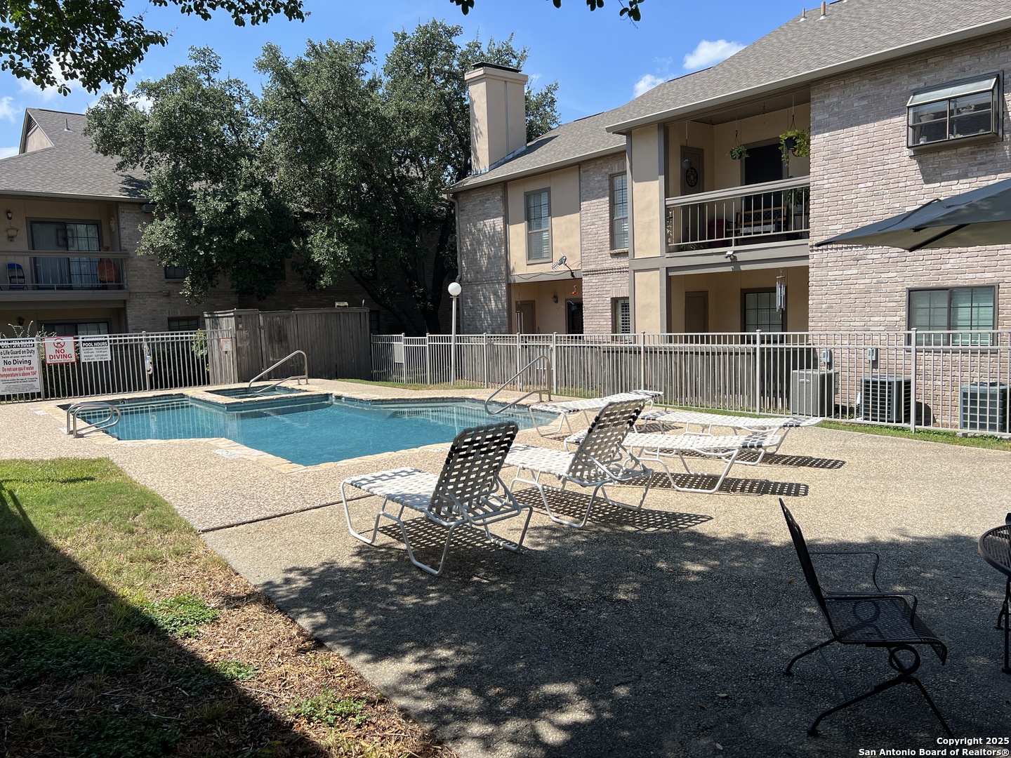 11839 Parliament Drive, Unit 1921 San Antonio, TX 78216 - Photo 14 of 19 a front view of a house with swimming pool