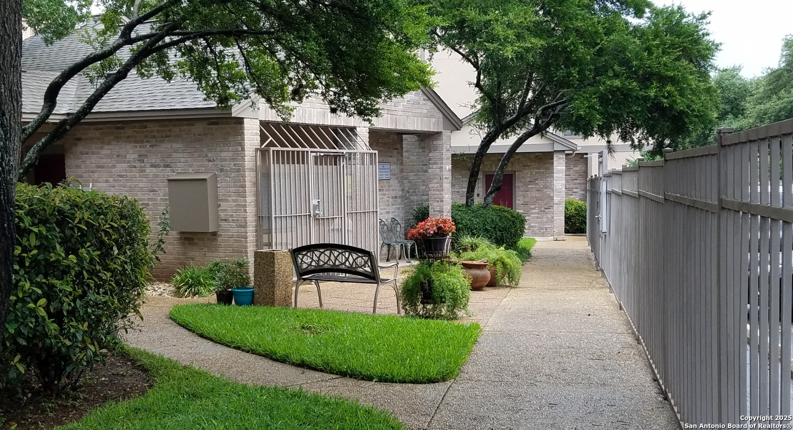 11839 Parliament Drive, Unit 1921 San Antonio, TX 78216 - Photo 19 of 19 a front view of a house with garden