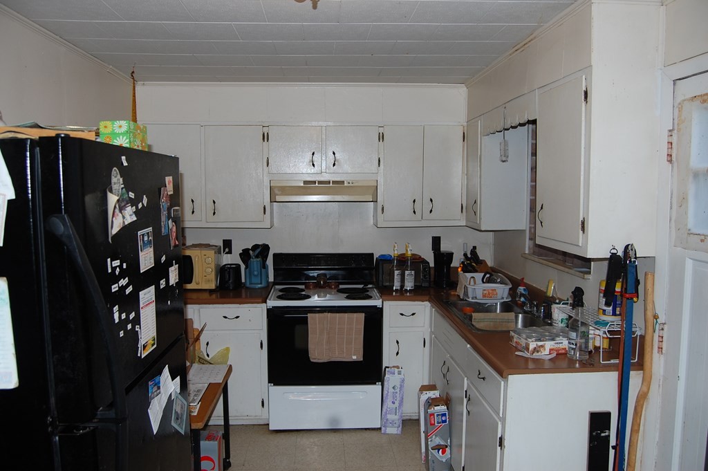 0 Proffitt Hill Lane Decatur, TN 37322 - Photo 11 of 16 a kitchen with stainless steel appliances a stove a refrigerator a sink and cabinets