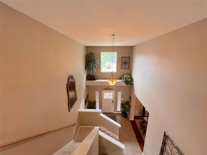 a white toilet sitting next to a bath tub