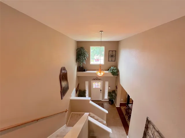 a white toilet sitting next to a bath tub
