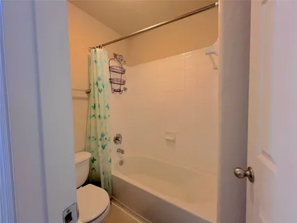 a view of walk in closet with clothes