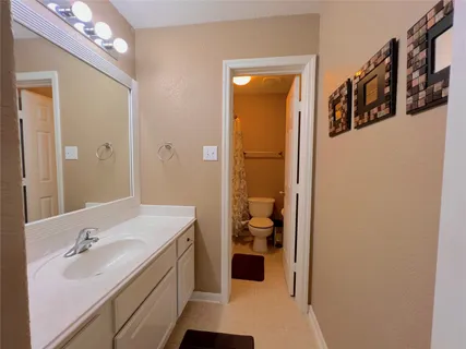 a view of a living room and a floor to ceiling window or wooden floor