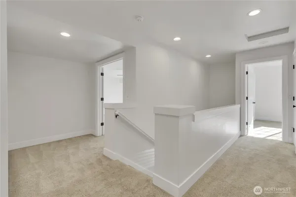 an empty room with a cabinet and mirror