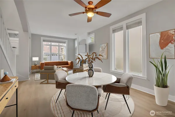 a living room with furniture potted plant and a window