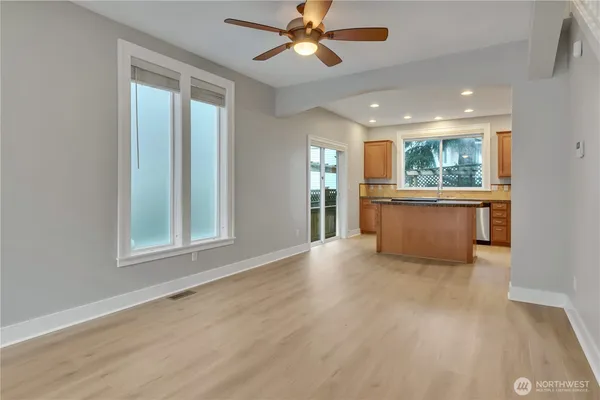 a view of a kitchen with a sink and a window