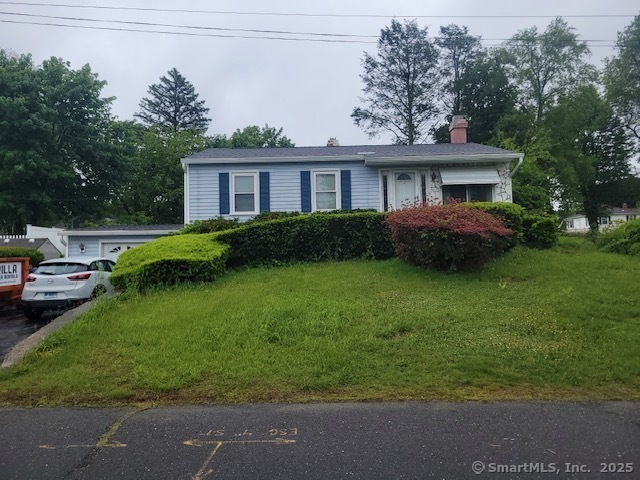 a view of a yard in front of a house