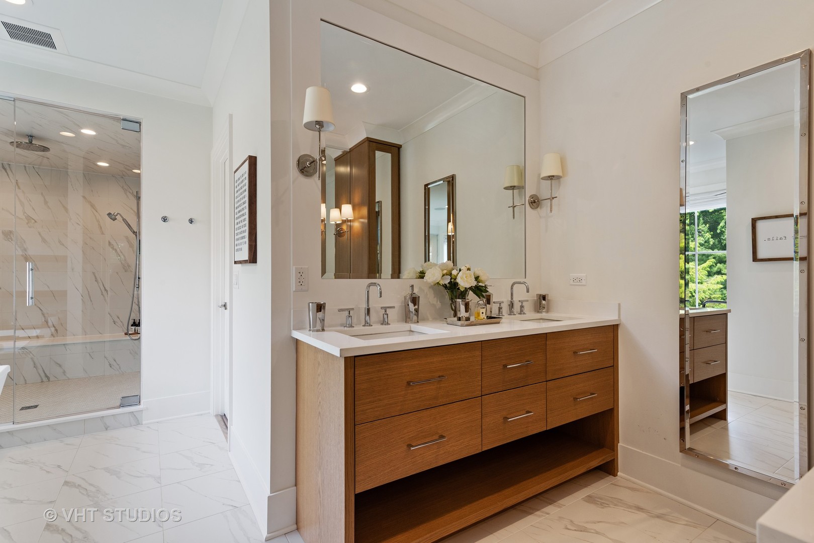 300 Greenleaf Avenue Wilmette, IL 60091 - Photo 15 of 43 a bathroom with a double vanity sink and a mirror