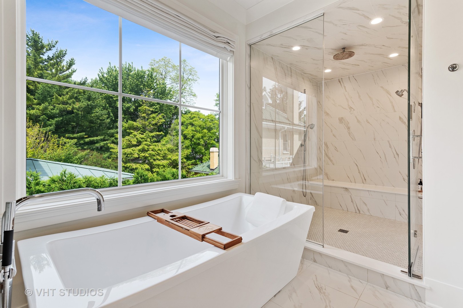 300 Greenleaf Avenue Wilmette, IL 60091 - Photo 16 of 43 a bathroom with a tub shower and window