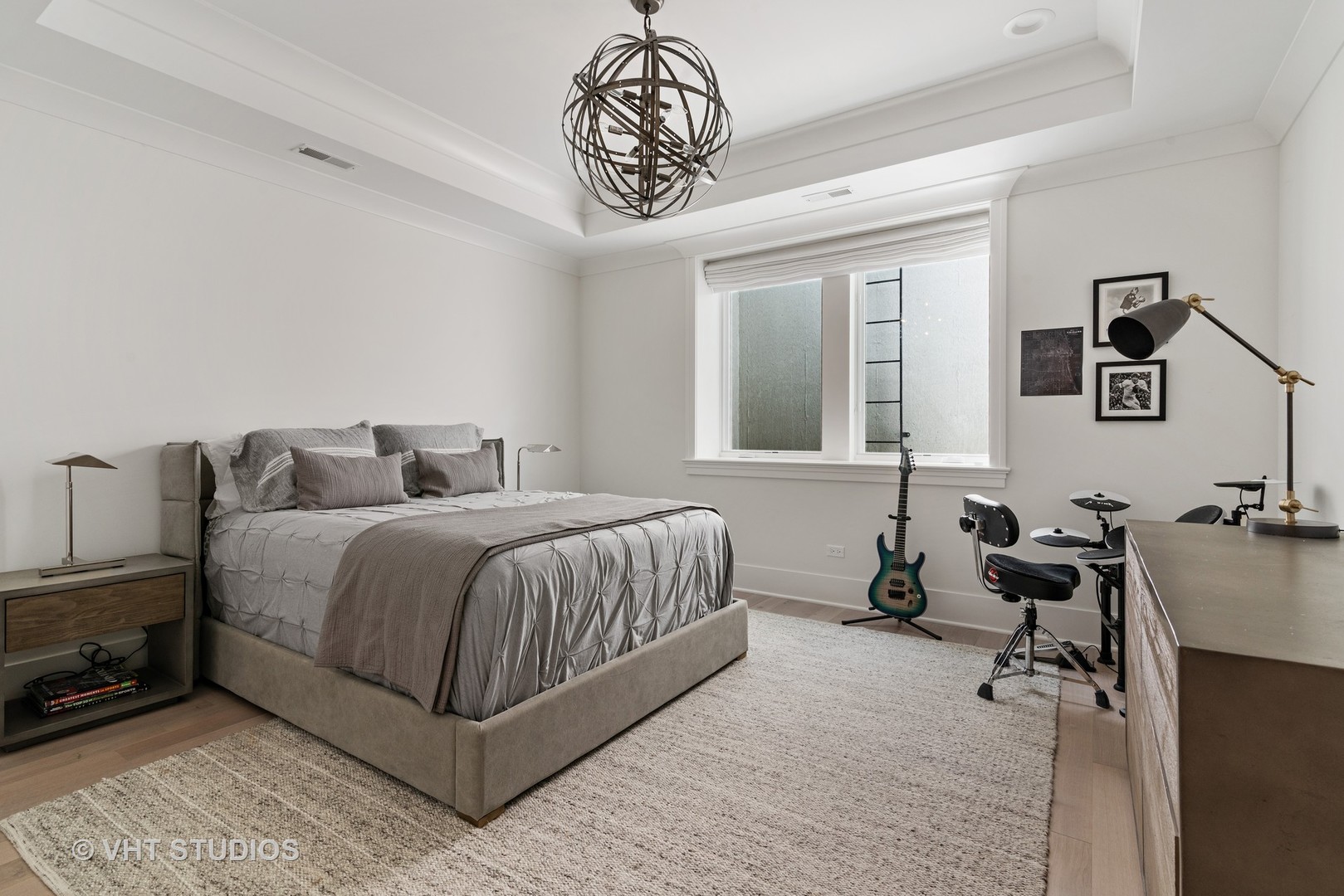 300 Greenleaf Avenue Wilmette, IL 60091 - Photo 18 of 43 a bedroom with a bed and a chandelier